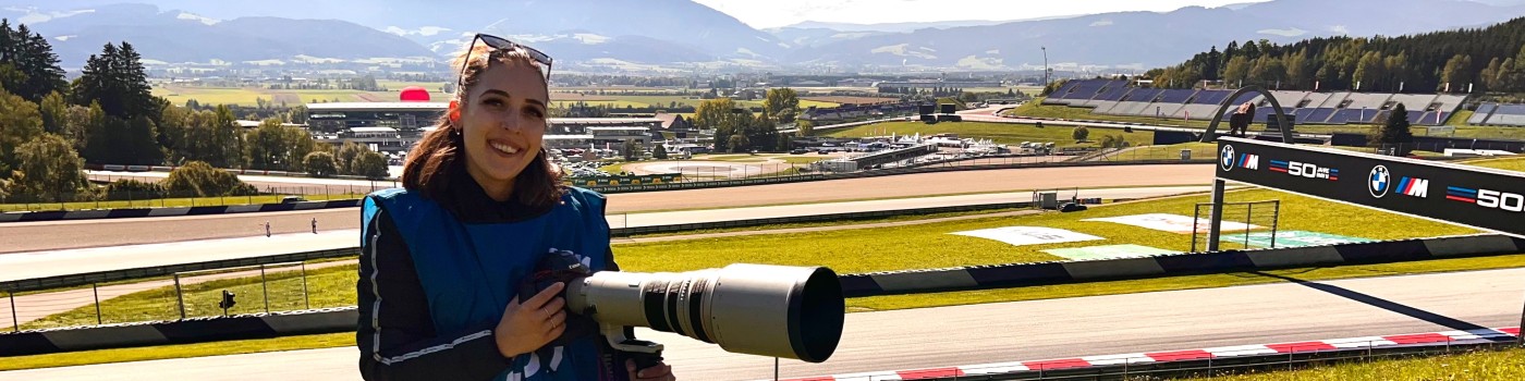Sophia Kuntzi with a camera at a race track